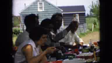 California USA (1969): People Eating And Drinking Outside At A Picnic On A Farm