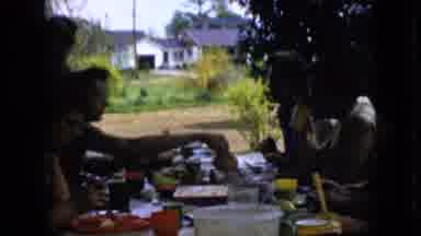 California USA (1969): People Are Eating Together By Serving Each Other
