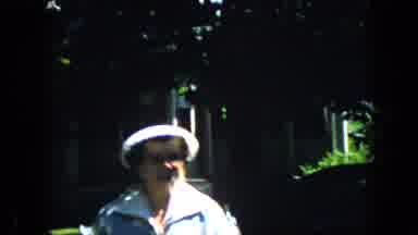 California USA (1969): Old Lady Walking Up To Camera