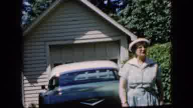 California USA (1969): Old Lady In Front Of A Car