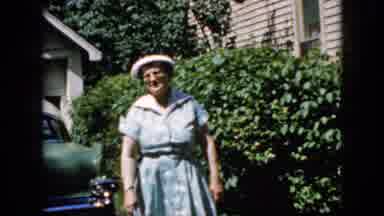California USA (1969): Lady Walking And Talking In A Driveway