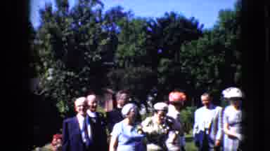California USA (1969): People In Dresses And Suits Outside On A Sunny Day Laughing