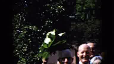 California USA (1969): A Man Among A Crowd Of People Waving A Palm Tree Branch