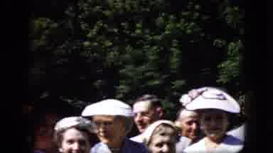 California USA (1969): Happy Elderly Group Stands Patiently Outdoors Dressed In