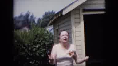 California USA (1969): Lady Talking To Local Neighbors