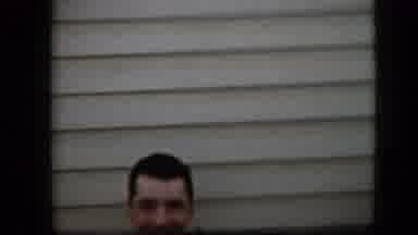 California USA (1969): Neck Up Male Smiling At Camera Next To House