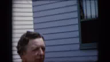 California USA (1969): Woman Speaks And Laughs With Friend Outside Home