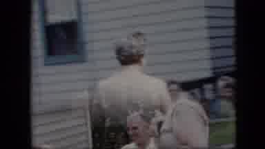 California USA (1969): Grandmother Before An Event Talking To Her Grandkids
