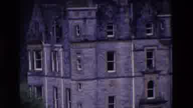 Ireland (1969): Castle Man Standing Holding A Pointed Gate Between 2 Rocks With A
