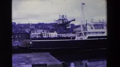 Ireland (1969): Old Cruiser Ship Docked In A Harbor With A Seagull Flying