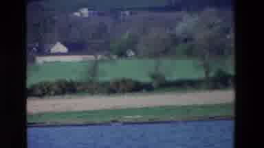 Ireland (1969): A Body Of Water Runs At The Base Of A Slope Filled With Meadows