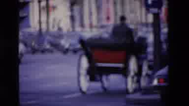 Loudes France (1969): A Horse Drawn Carriage Riding Down The Road And A Woman