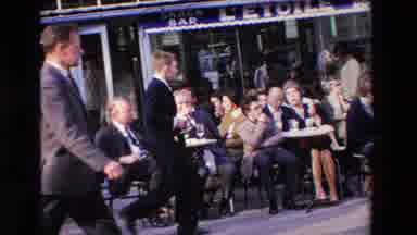 Loudes France (1969): People Walking Past An Outdoor Cafe With Many People Eating