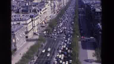 Loudes France (1969): Overhead View Of Traffic Congestion Along A Tree Lined City