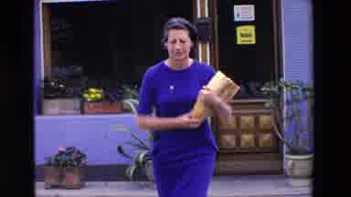 Loudes France (1969): Woman Leaving Store Happy With Her Large Half Loaf Of Bread