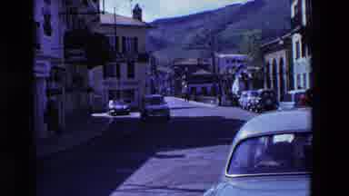 Loudes France (1969): A Woman Cutting A Loaf Of Bread, Then A Car Driving Down The