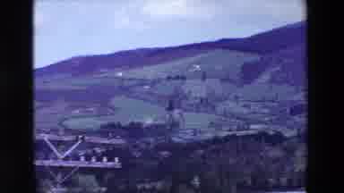 Loudes France (1969): Meadows And Trees Cover The Slope Of A Mountain In The