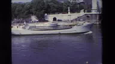 Paris France (1969): A Boat Sailing On A River Goes Under A Bridge