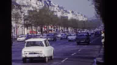 Paris France (1969): Vintage Cars Ride Down Busy Highway