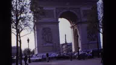 PARIS FRANCE-1969: Standing On A Busy Paris Street Watching Pedestrians And Cars