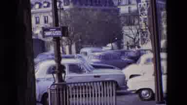 Paris France (1969): A Man Standing On The Opposite Side Of The Street While Cars