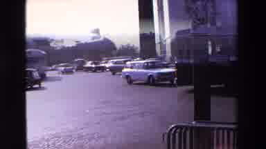 PARIS FRANCE-1969: Classic Cars Driving Past Arc de Triomphe