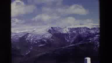Spain Vineyards (1969): Snow Covered Mountains Stretch From A Road To The Horizon