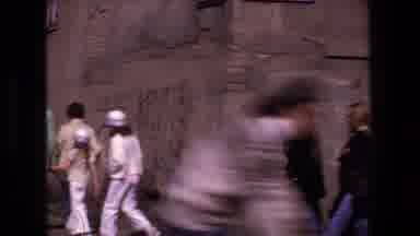 Strasburg France-1970: Tourists Walking Through Historic Alley With Street Signs