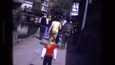 Strasburg France (1970): Young Girl With Ponytail Walks Near People Looks At River