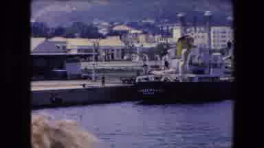 Algeria (1971): Zoom Boat In Water Next To Boardwalk Person Hills In The