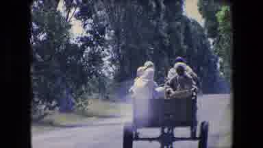 Algeria-1971: People Ride In Wooden Cart Through Rural Village