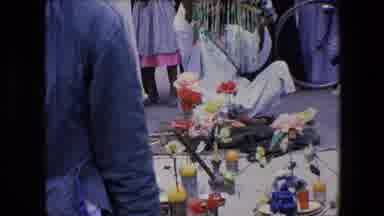 Algeria (1971): Man Sitting On Blanket Surrounded By Candles And Flowers Holding