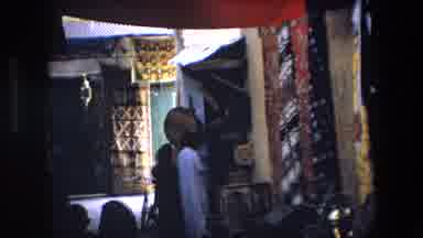 Algeria (1971): Taking A Stroll And Surveying A Middle-Eastern Rug And Textile