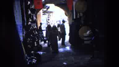 ALGERIA-1971: Women Walking Down An Alley In A Moroccan Marketplace