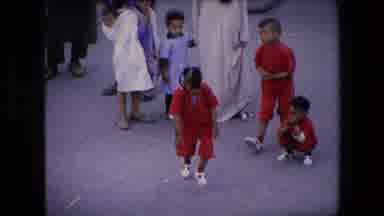Algeria (1971): A Young Girl Performing Cartwheels In A Street Fair