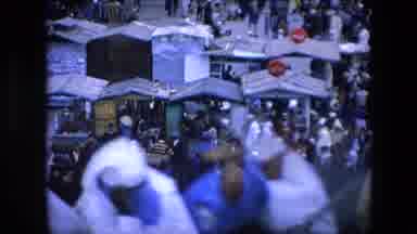 Algeria (1971): Women In Full Burka Riding A Carriage To A Market Full Of People