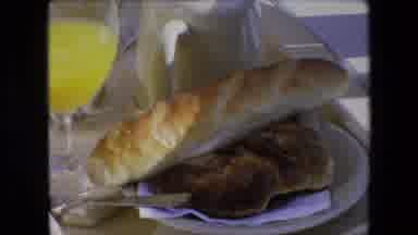 ALGERIA-1971: Eating Breakfast With Orange Juice, A Loaf Of Bread And Coffee