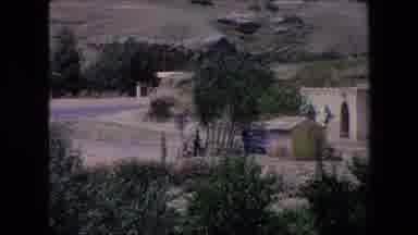 Algeria (1971): House Dirt Grass Brick Wood Windows Outside Sun