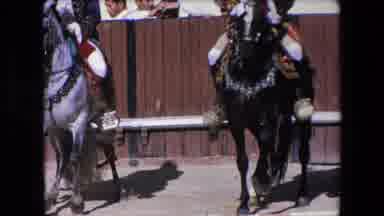 Barcelona Spain (1971): Two Men In Costume Ride Horses Alongside Each Other