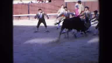 Barcelona Spain (1971): Bullfighters Run From An Angry Bull Charging At Them
