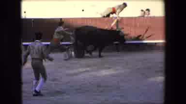 Barcelona Spain (1971): A Bull Knocks Down A Matador In A Stadium As A Crowd