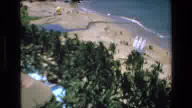 Mazatlan Mexico (1972): A Building Stands In Front Of A Grove Of Palm Trees And An
