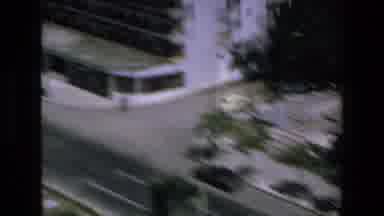 Mazatlan Mexico (1972): Traffic Zooming By, As A Yellow Parachute Drifts Lazily