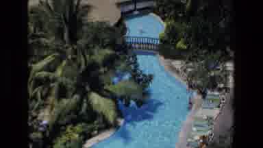 Mazatlan Mexico (1972): Vacationers Looking Out At The Bay And A Resort On The