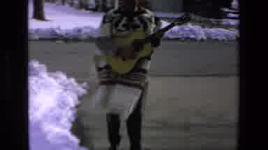 Mazatlan Mexico (1972): Man Walking On The Driveway While Playing Guitar And