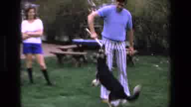 Mazatlan Mexico-1972: Man Playing With Dog in Backyard