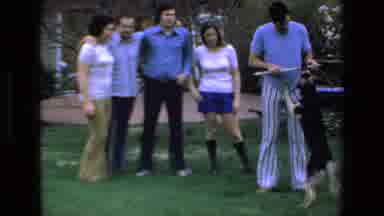 Mazatlan Mexico (1972): Man Plays With Dog As Friends And Or Family Watch