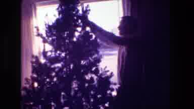 Hollywood California USA (1981): Man Is Decorating Christmas Tree