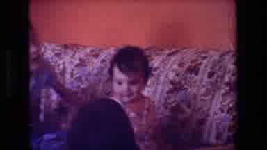 Hollywood California USA (1981): Baby And Child On The Sofa