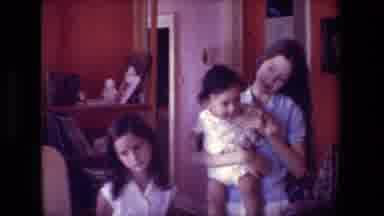 Hollywood California USA (1981): Two Young Girls, One Holding A Small Child In A